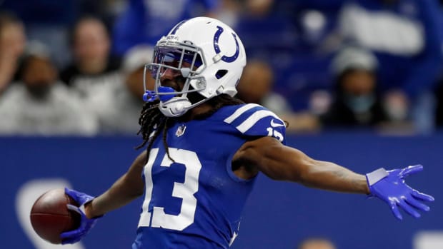 Indianapolis Colts wide receiver T.Y. Hilton (13) celebrates after catching the ball for a touchdown after it's juggled by Indianapolis Colts wide receiver Ashton Dulin (16), Las Vegas Raiders free safety Tre'von Moehrig (25) and Las Vegas Raiders cornerback Casey Hayward Jr. (29) on Sunday, Jan. 2, 2022, during a game against the Las Vegas Raiders at Lucas Oil Stadium in Indianapolis.